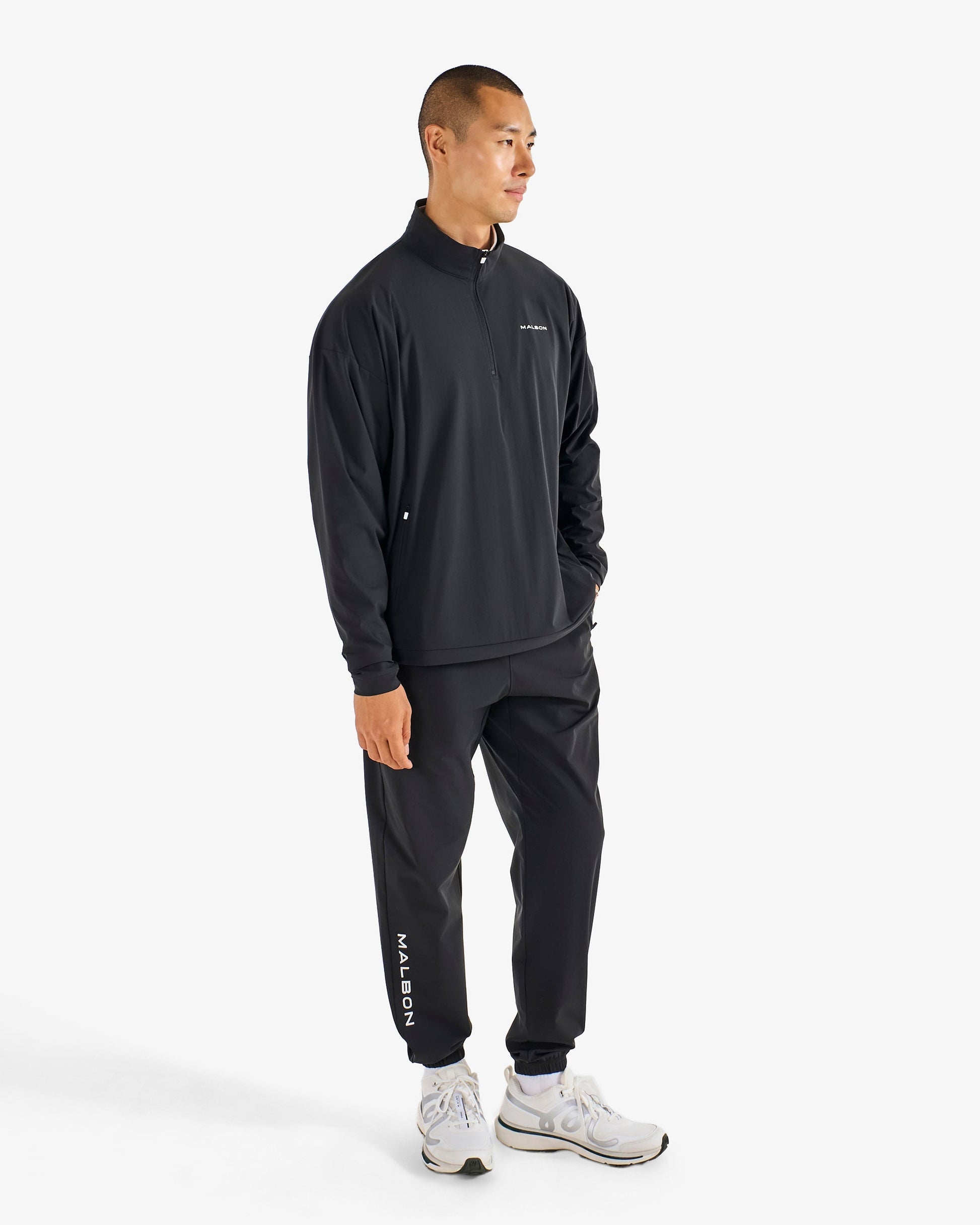 PERFORMANCE QUARTER ZIP SHELL PULLOVER