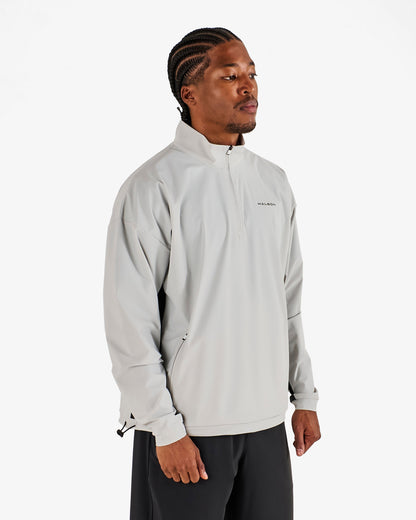 PERFORMANCE QUARTER ZIP SHELL PULLOVER